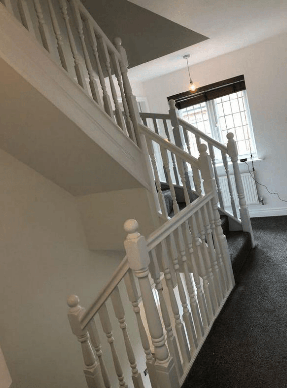 White hallway landing and staircase painted by painters and decorators Glasgow