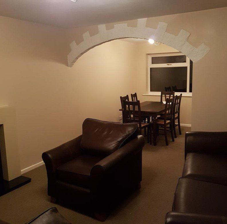 A picture of an open plan living room painted in magnolia by painters and decorators Glasgow