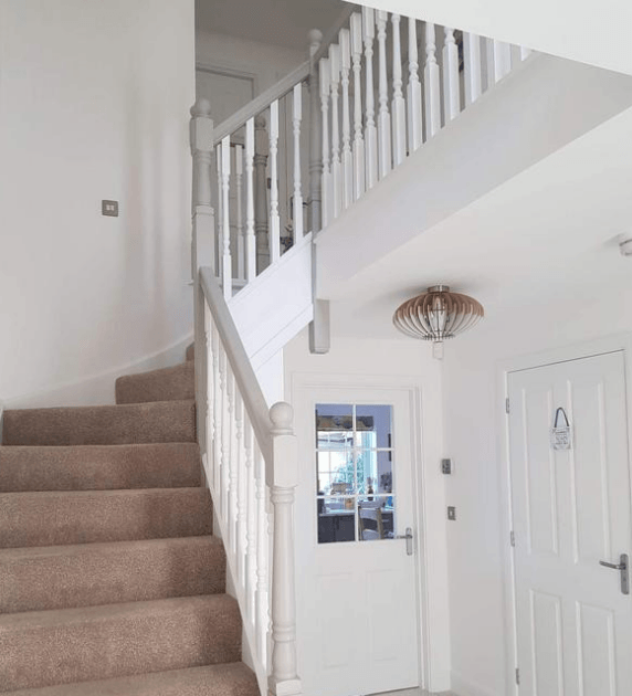 Entrance hall, staircase and kitchen door all painted in fresh brilliant white by painters and decorators Glasgow