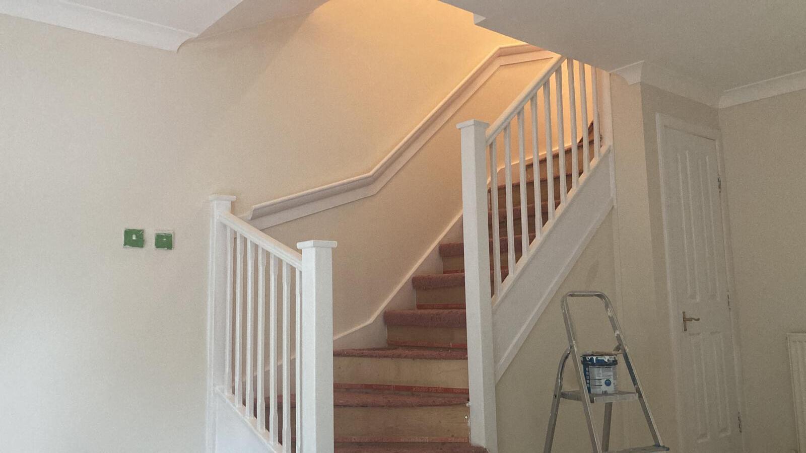 A picture of stairs painted in white gloss by painters and decorators Glasgow