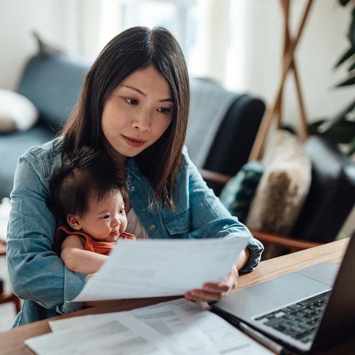 Woman At Home With Her Child — United States — NextGen Financial Advice