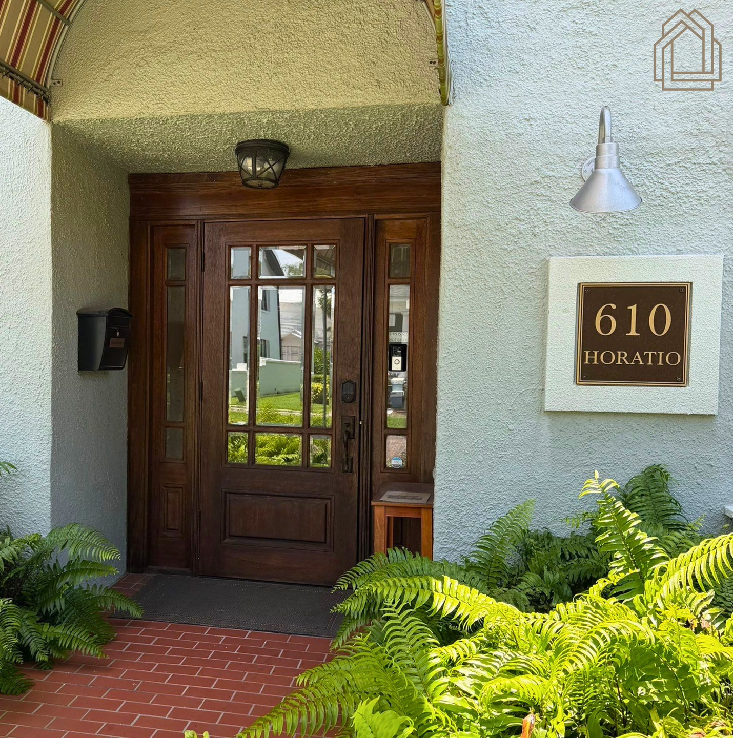 Entrance to Pristine Remodeling's Tampa Bay office on Horatio Street, featuring a covered walkway and entrance.