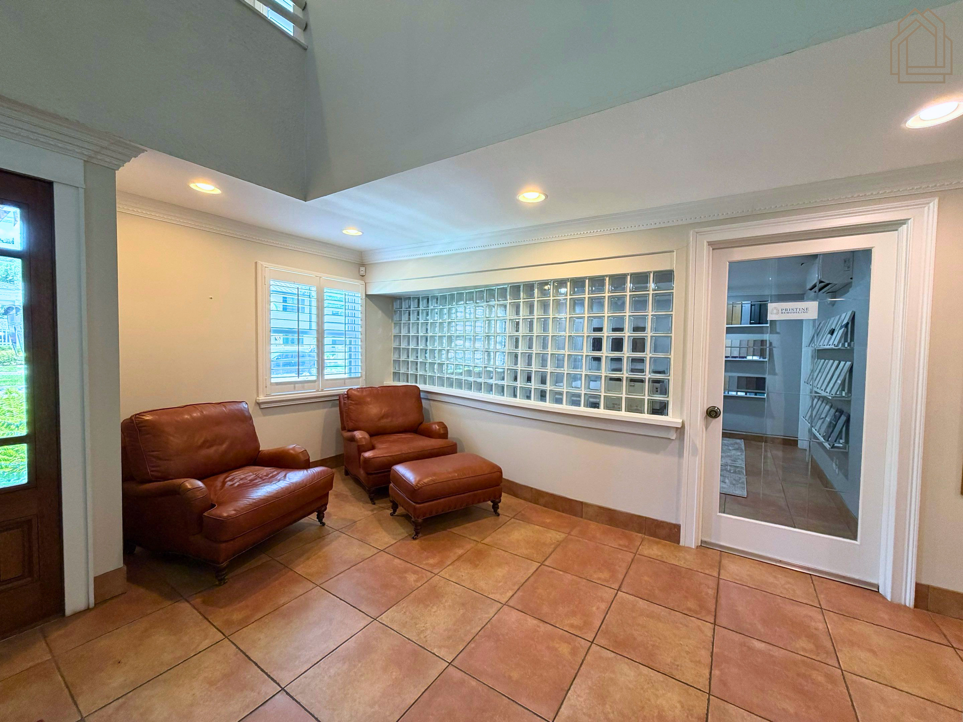 Comfortable client waiting area inside Pristine Remodeling's Tampa Bay office with seating and access to the design showroom.