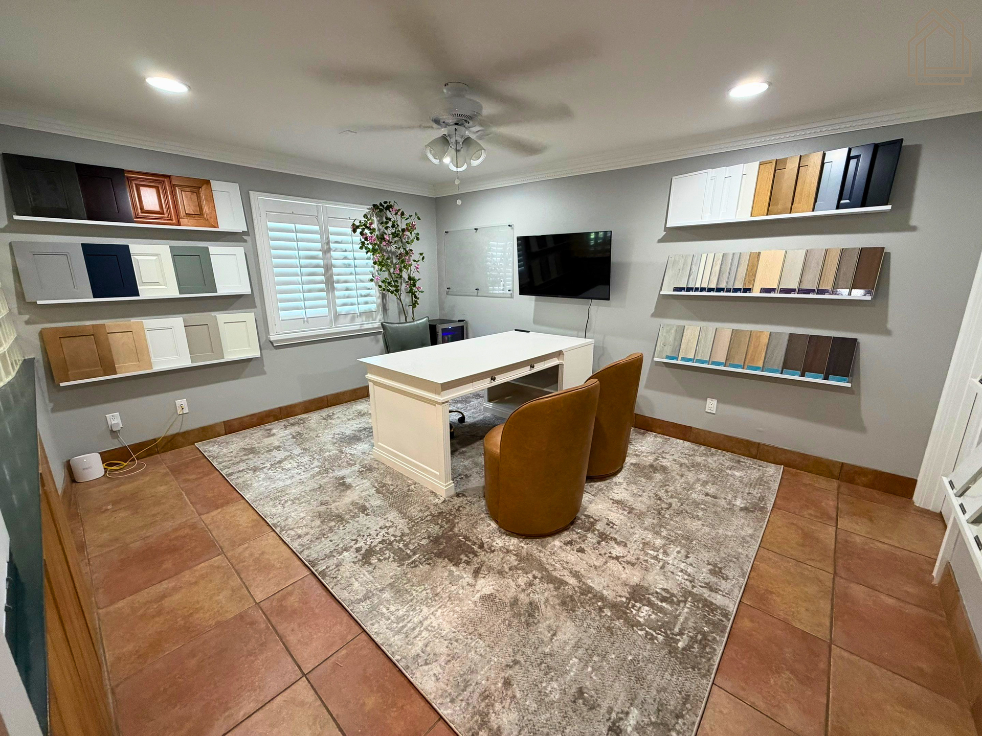 Design consultation room at Pristine Remodeling's Tampa Bay showroom with cabinetry, countertop, and flooring samples.