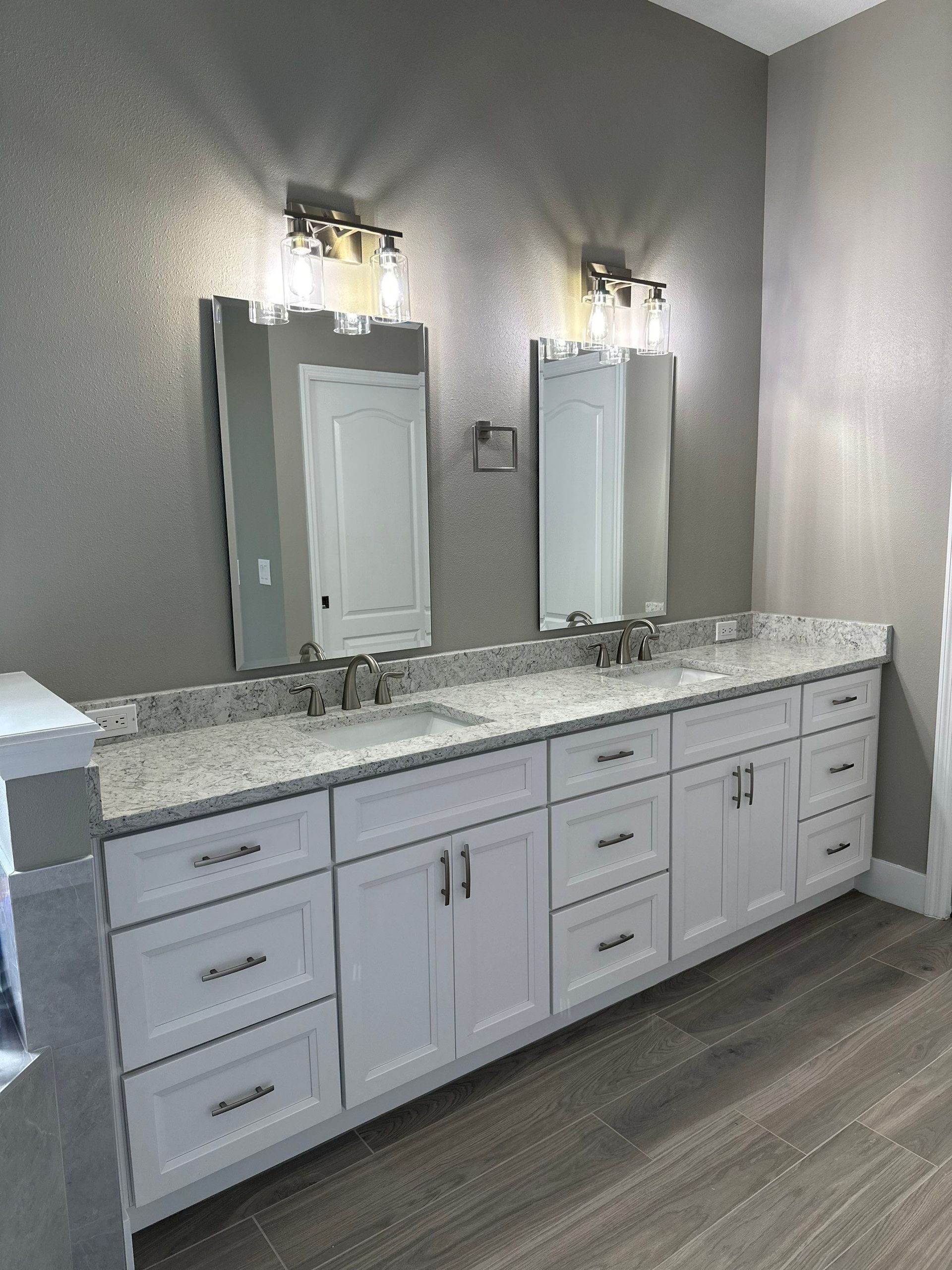 custom bathroom cabinets
shaker style vanity
bathroom cabinet installation
bathroom storage cabinets
luxury bathroom remodel
custom vanity design
cabinetry and storage
bathroom organization