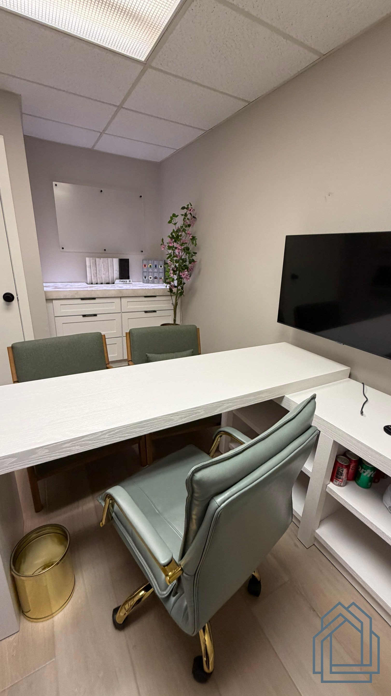 Cabinet door styles, countertop samples, and hardware displays inside Pristine Remodeling's South Lakeland design center.