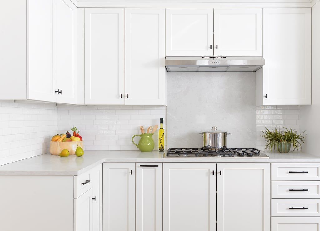 White shaker stock kitchen cabinets installed in a bright modern kitchen.
stock kitchen cabinets
affordable kitchen cabinets
shaker style cabinets
kitchen cabinet installation
kitchen remodeling
ready to install cabinets
