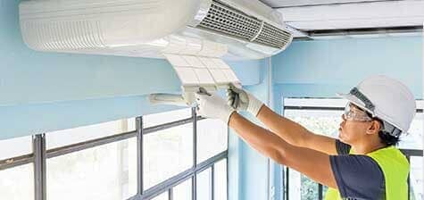 Technician Repairing Air Conditioner — Ventilation in South Sioux City, NE