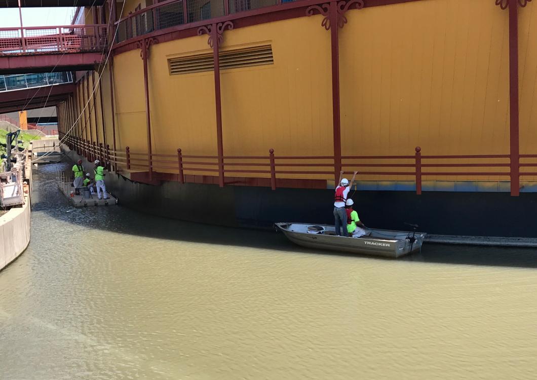 The dayco team strategically painting while on boats.