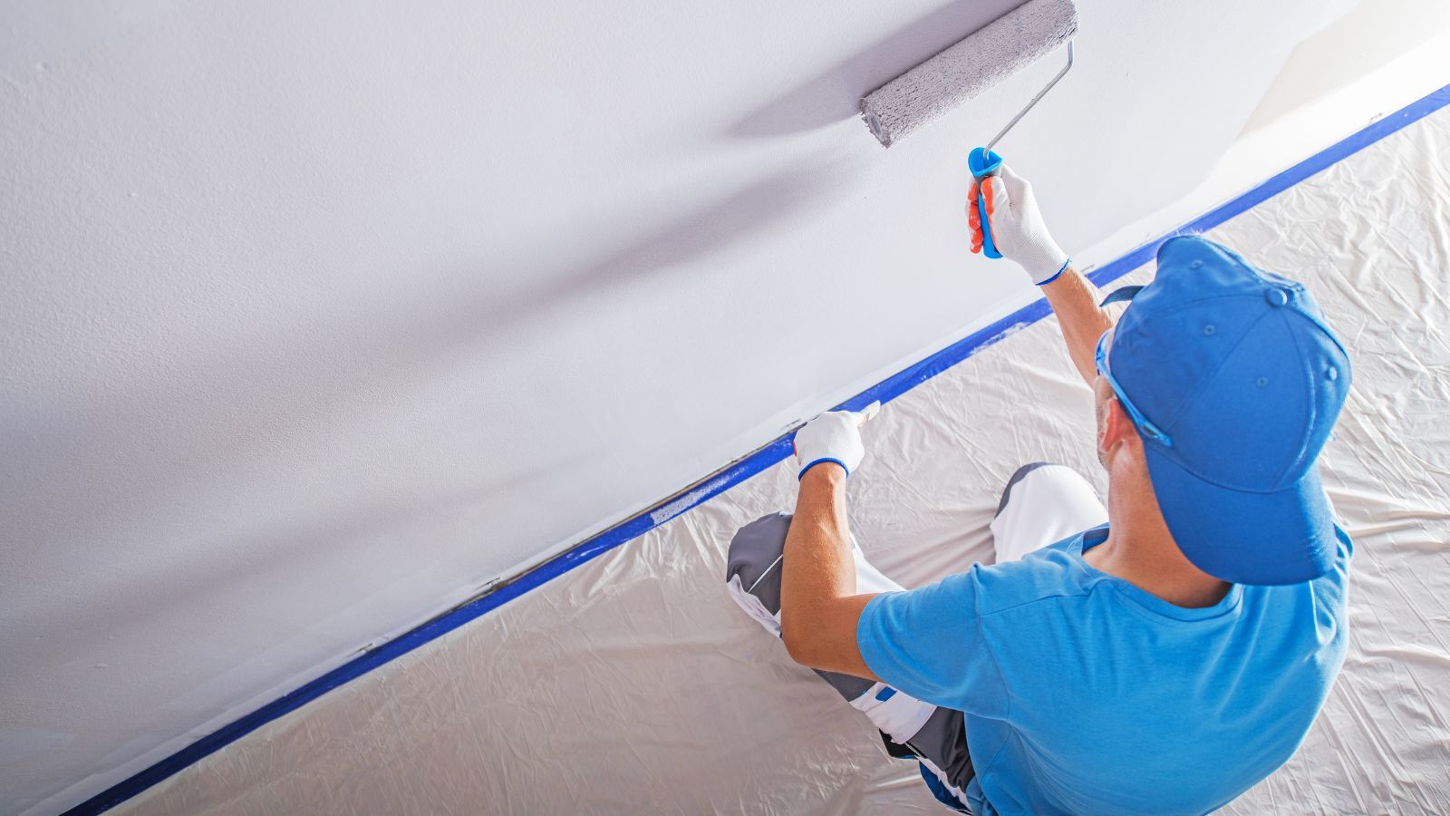 commercial interior painter working on business painting