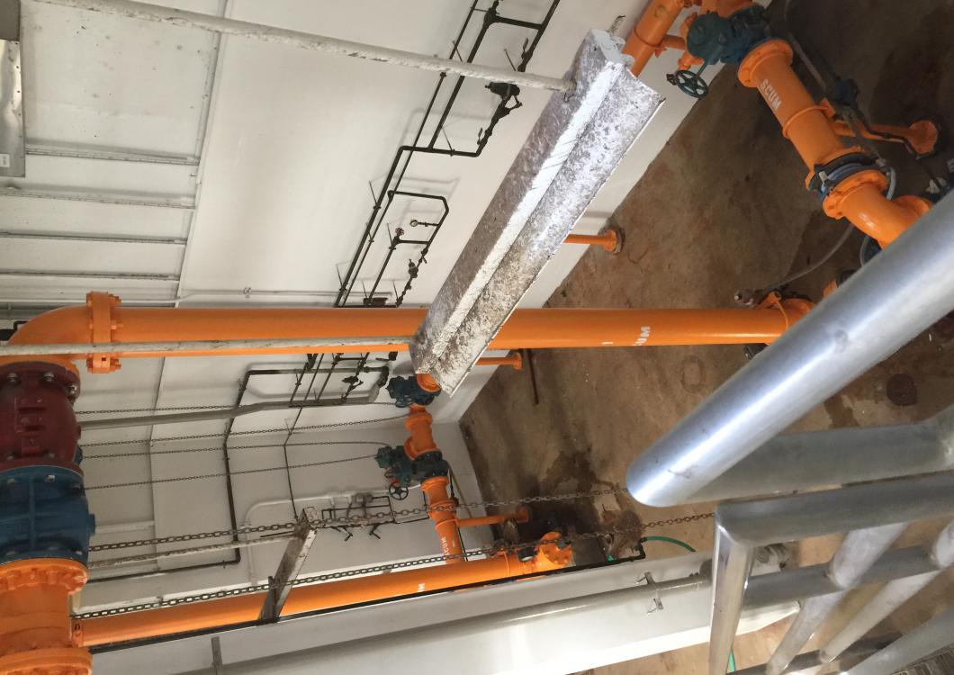 Dayco painting project: industrial building with orange pipes