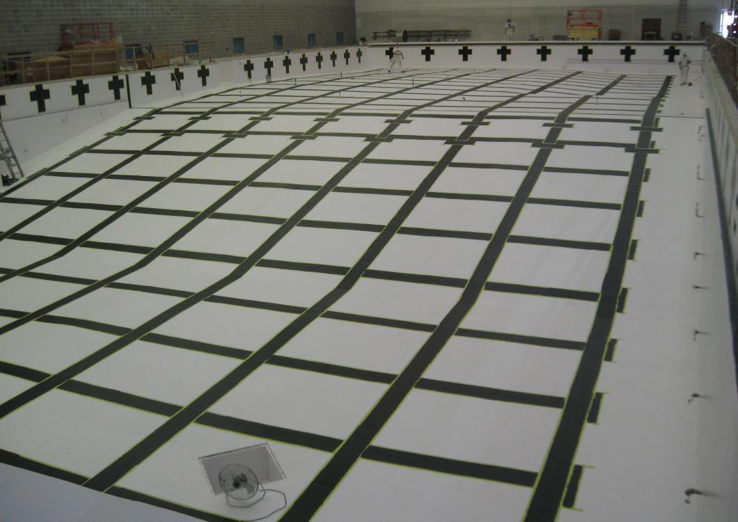 Emptied pool as Dayco's team applies new paint lines.