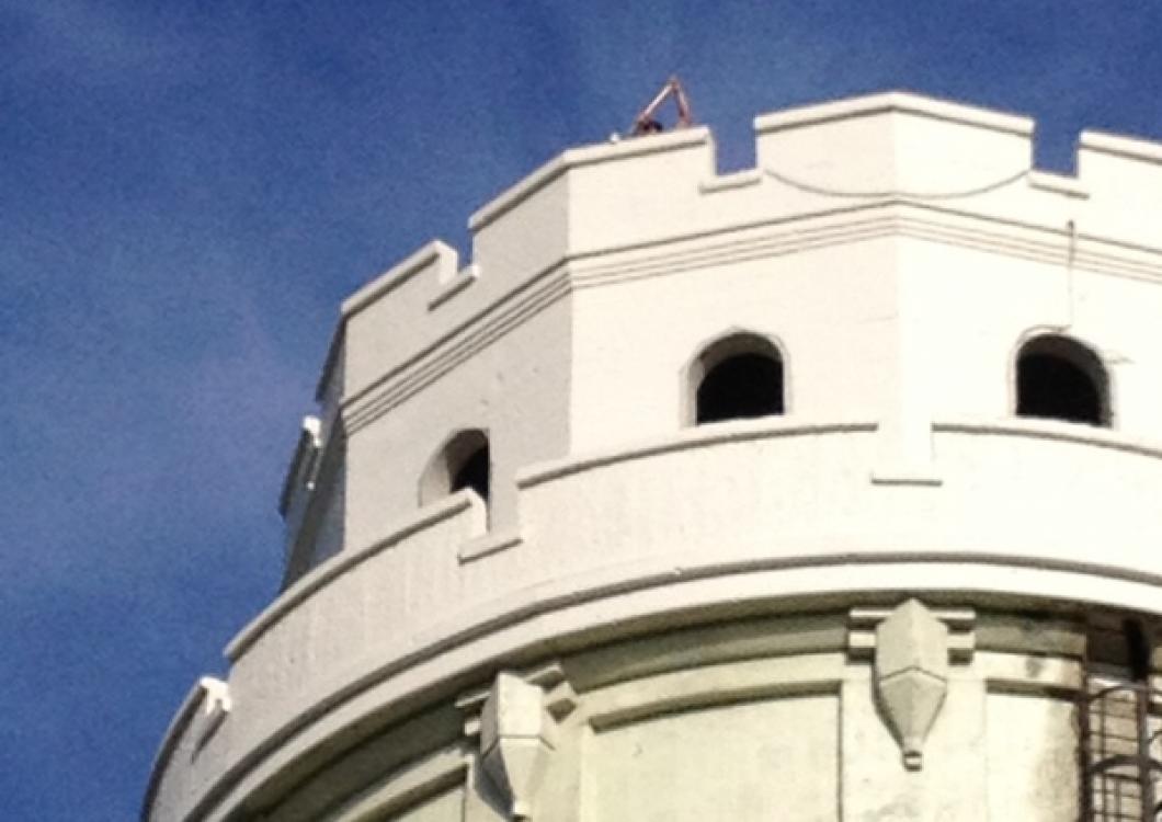 Dayco team on top of city building applying top quality paint