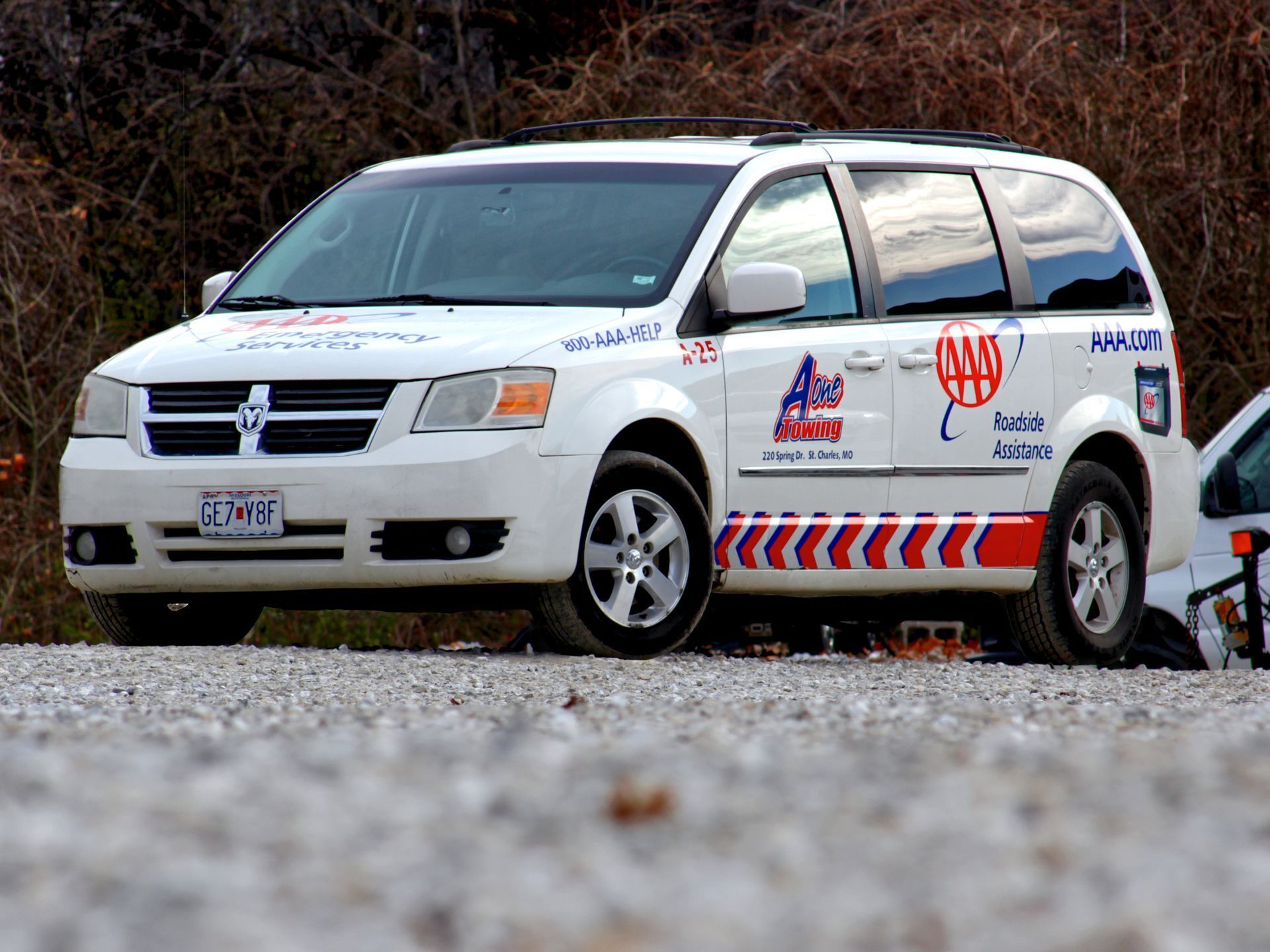 White AAA Dodge van.