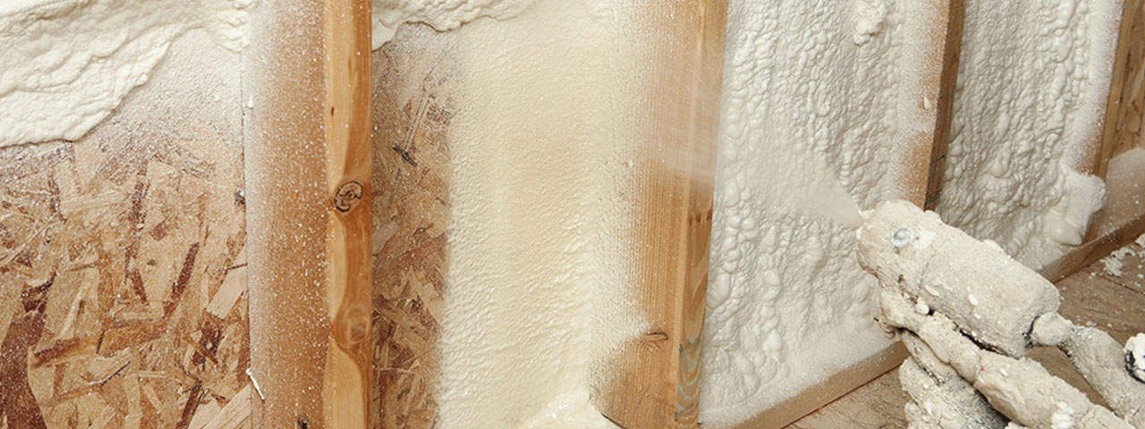 A close up of a wall with spray foam on it.