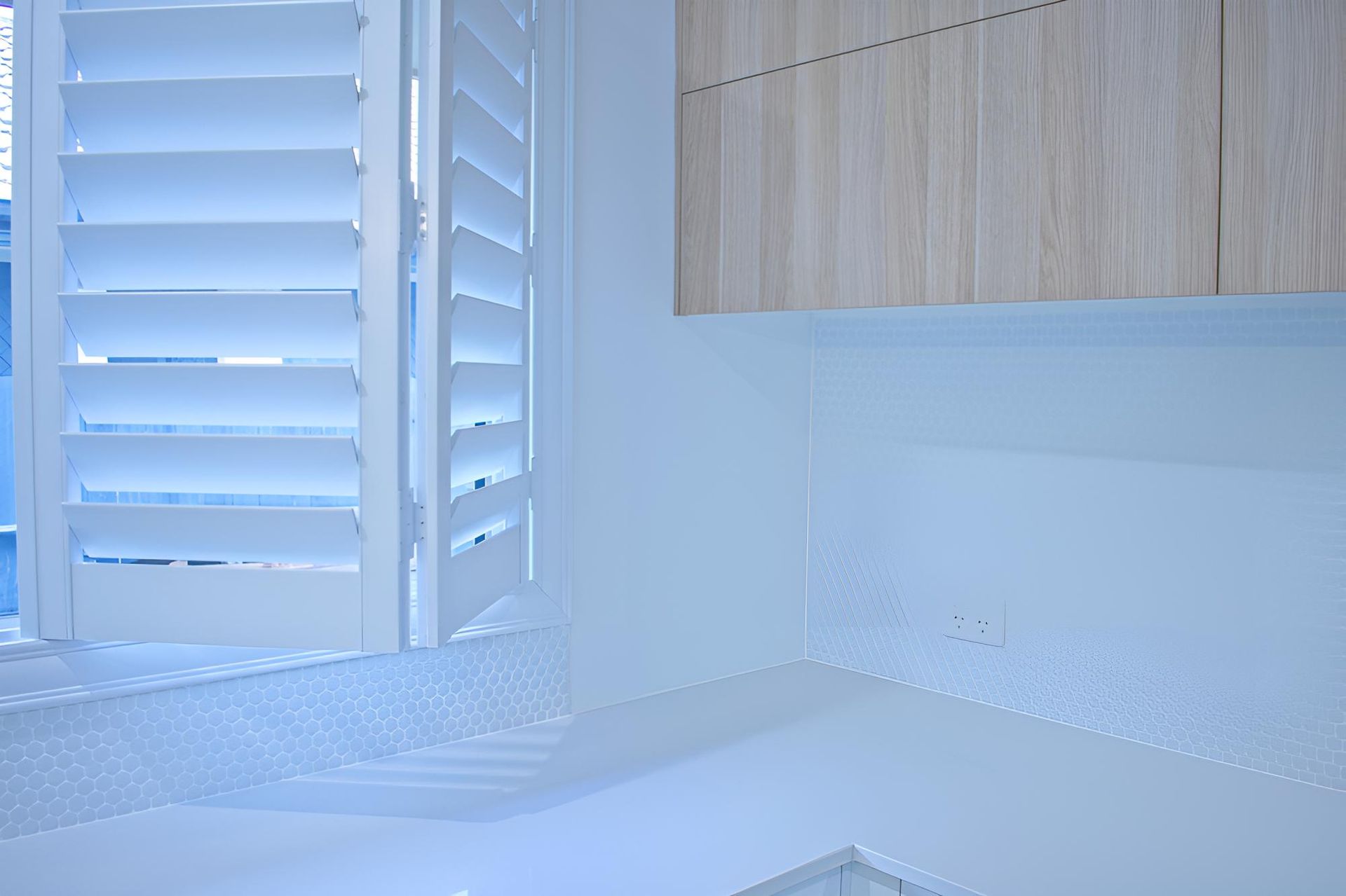 Bathroom With White Shutters on the Window — Ezi Slide - Glass, Sliding, Track & Security Doors Repair in Ashmore, QLD