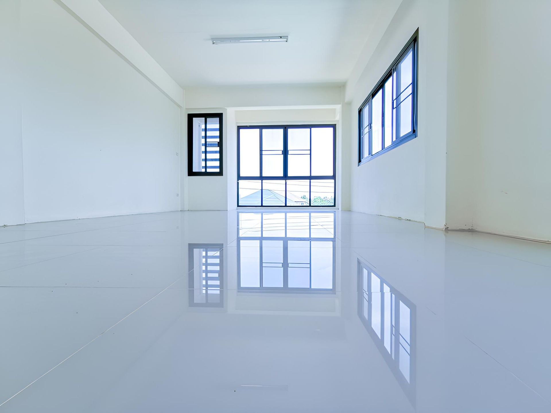 Empty Room With a White Floor and a Lot of Windows — Ezi Slide - Glass, Sliding, Track & Security Doors Repair in Ashmore, QLD