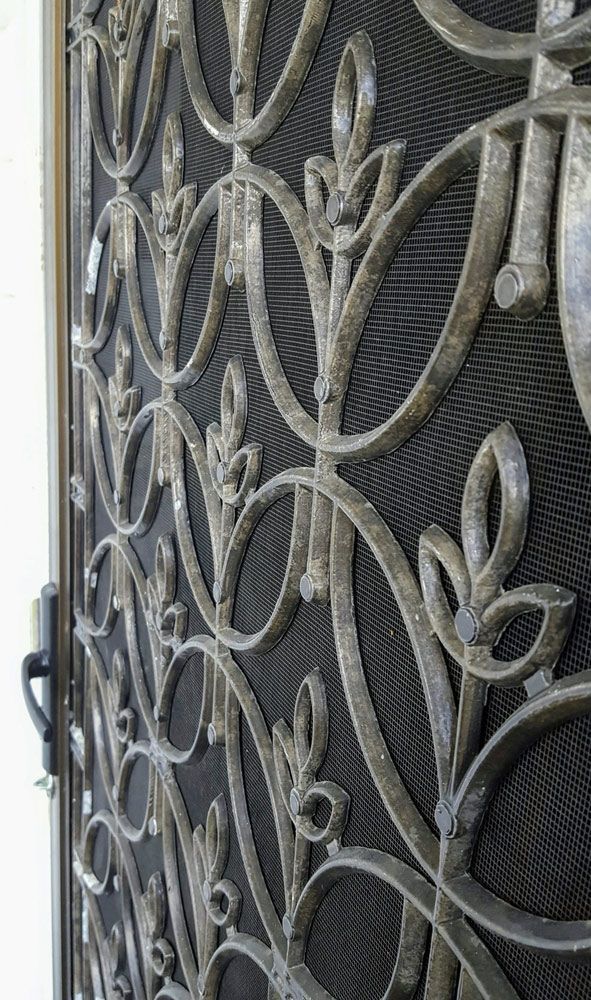 Close Up Of A Wrought Iron Door With A Pattern — Ezi Slide - Glass, Sliding, Track & Security Doors Repair in Ashmore, QLD