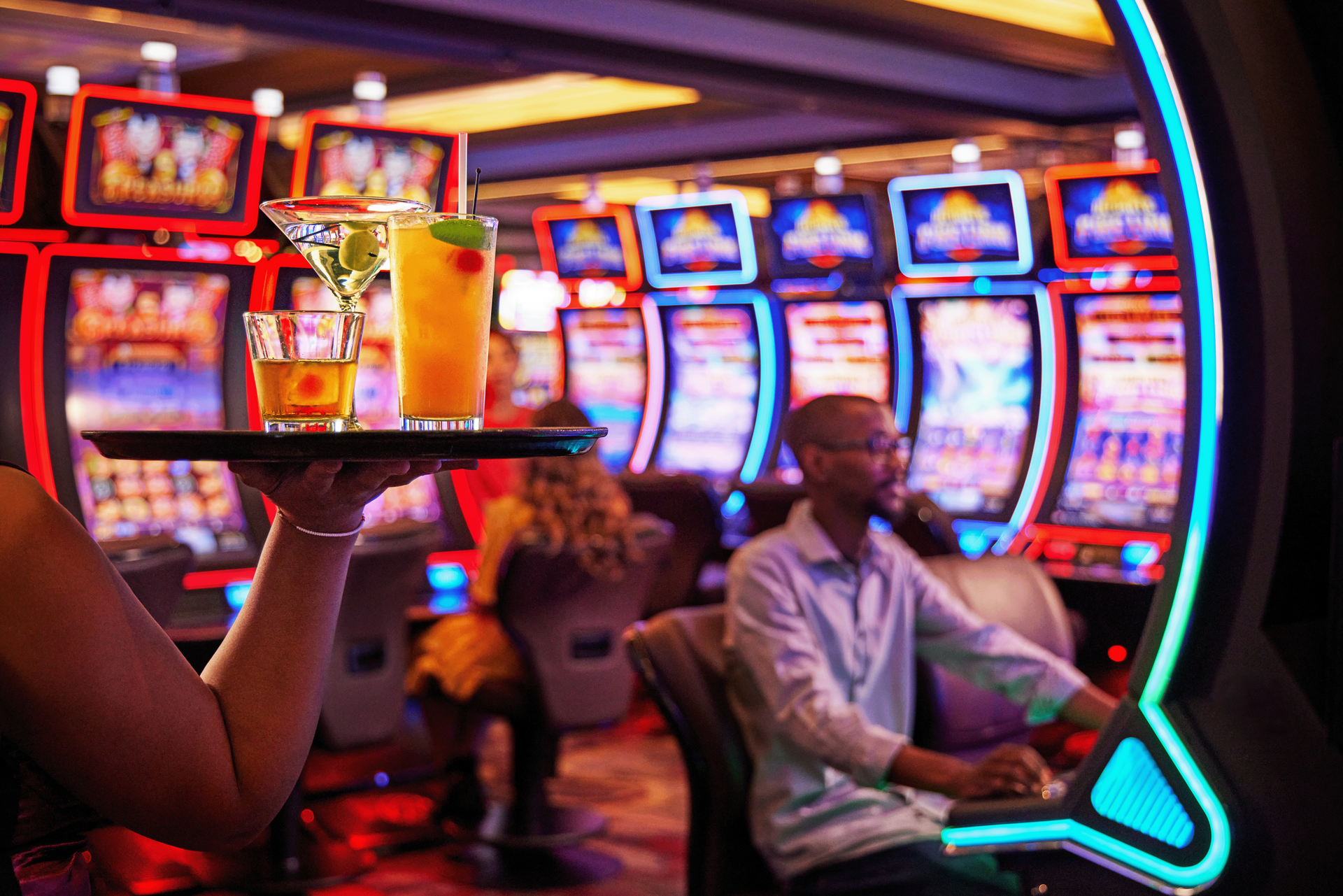 A group of people are playing roulette in a casino.