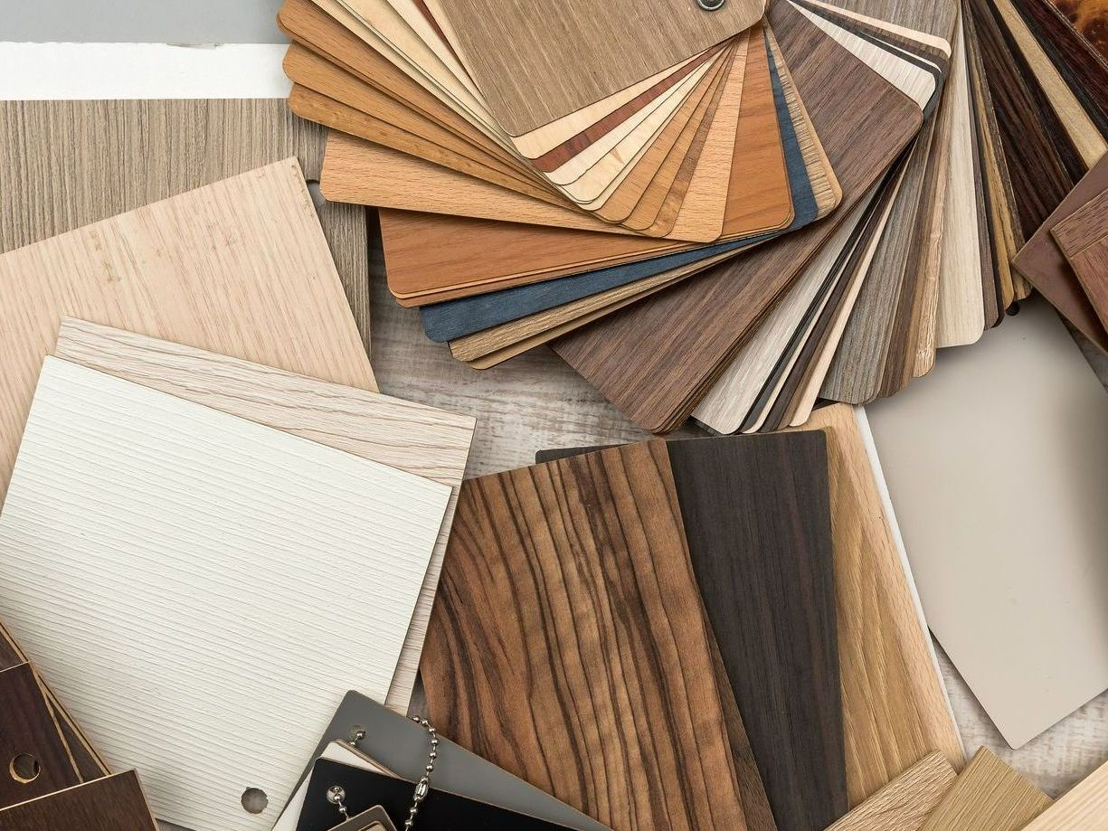 There are many different types of wood samples on the table.