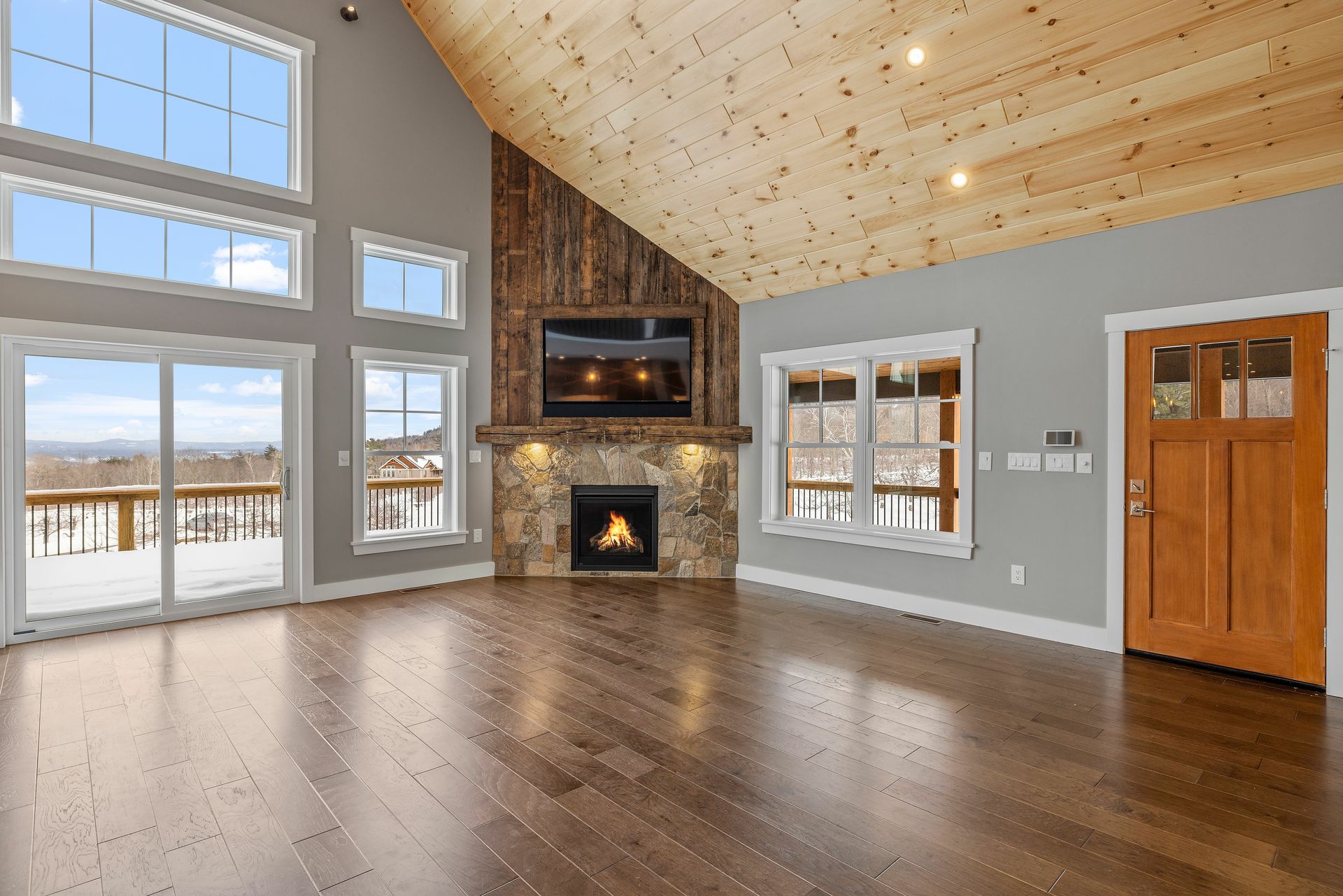 There is a fireplace in the middle of the living room.
