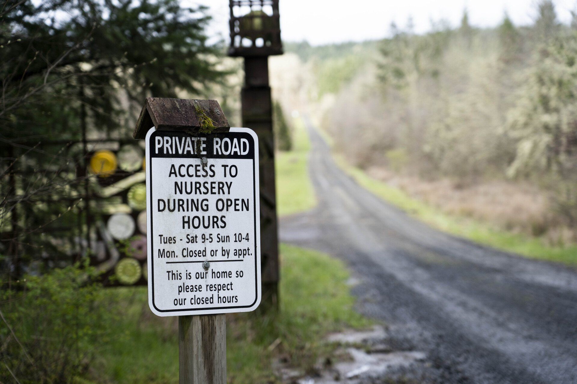 Sign on a private road leading to a nursery.