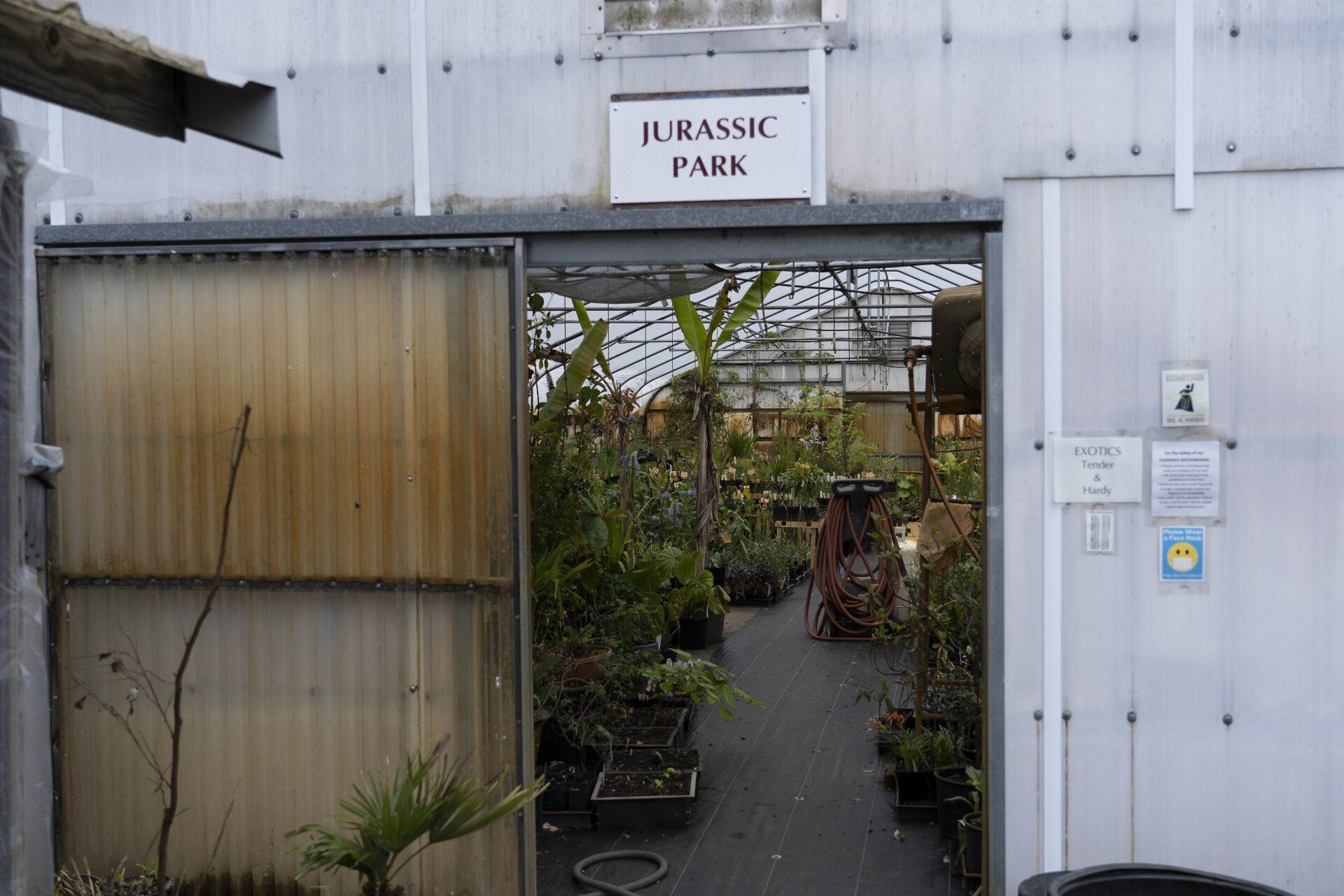 Greenhouse entrance labeled 