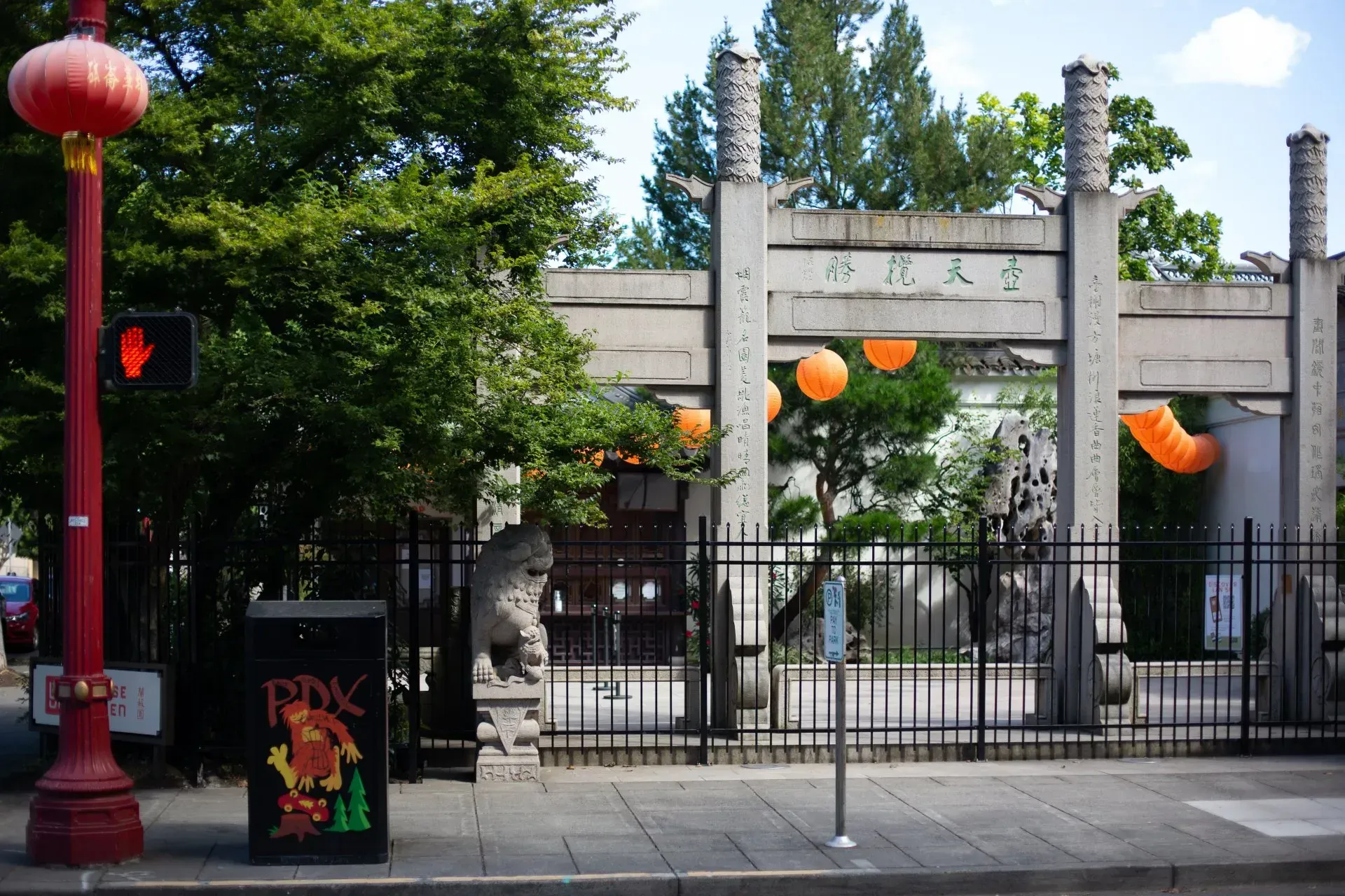 Stone gate entrance to Vancouver's Chinatown, with a red lantern.