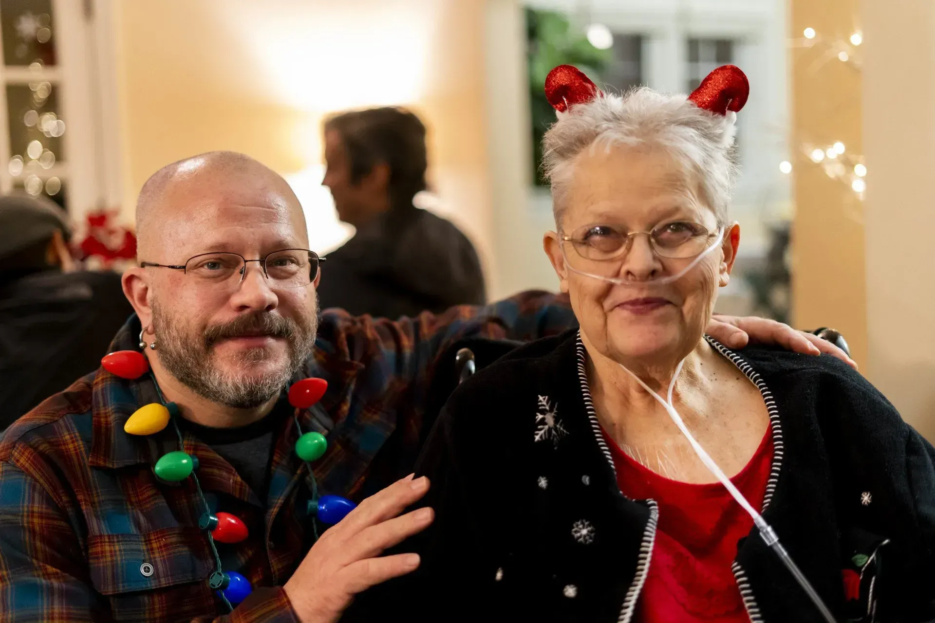 A man with a beard and Christmas lights.