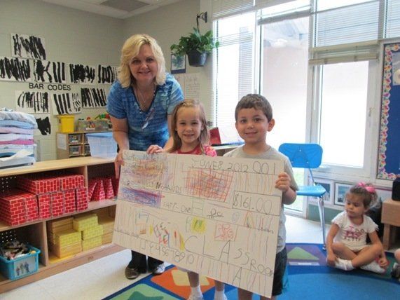 Karen Swedenborg presented with check from Pre-K at Karen Slattery