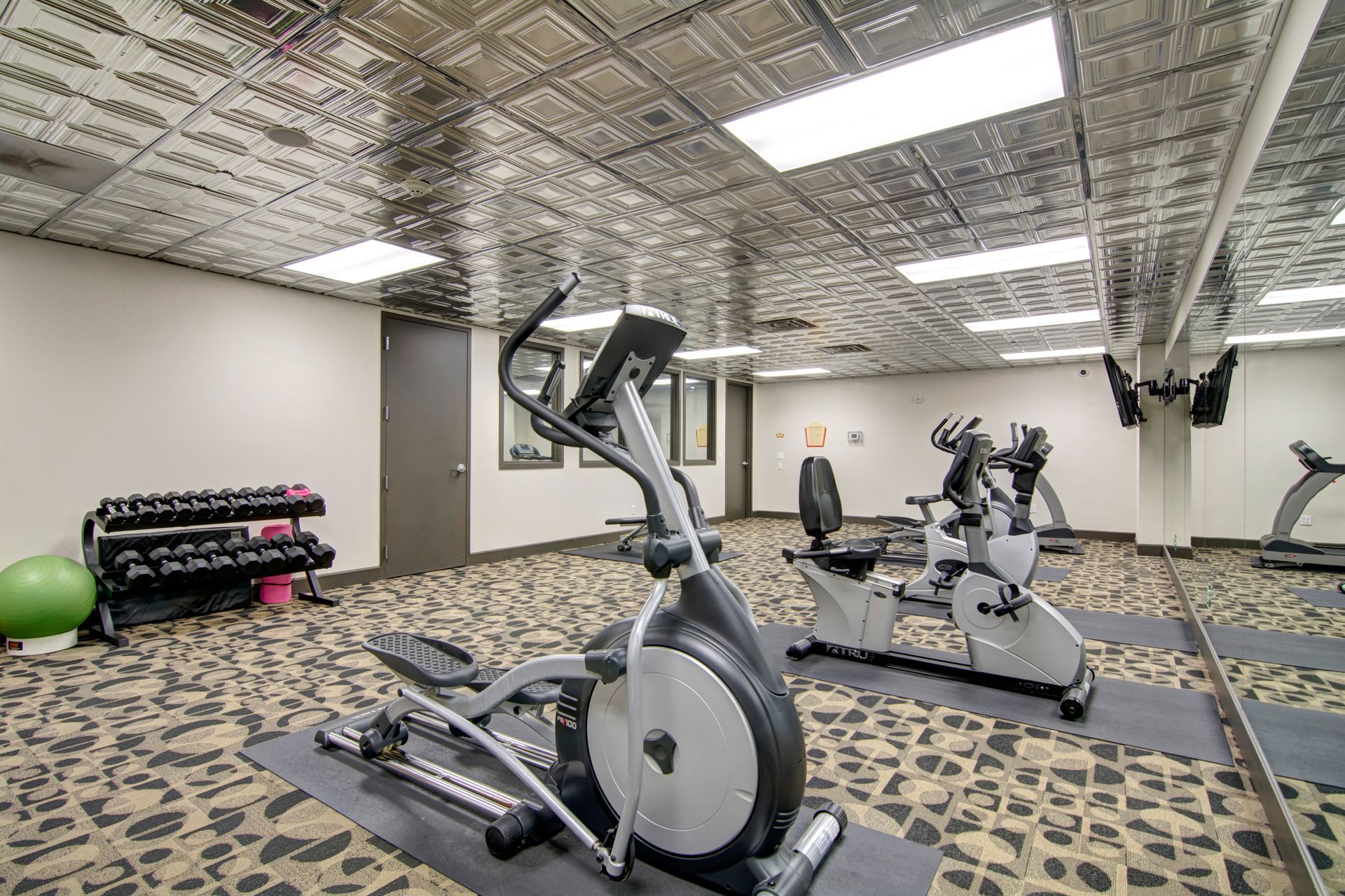 There are a lot of exercise equipment in the gym.