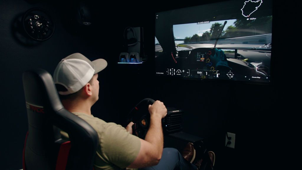 Professional racing simulator cockpit with triple screens
