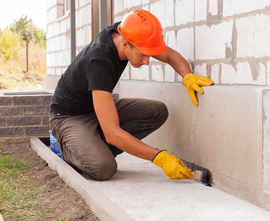 Worker Fixing Foundation — Houston, TX — Sandtech – S. T. Construction Corp.