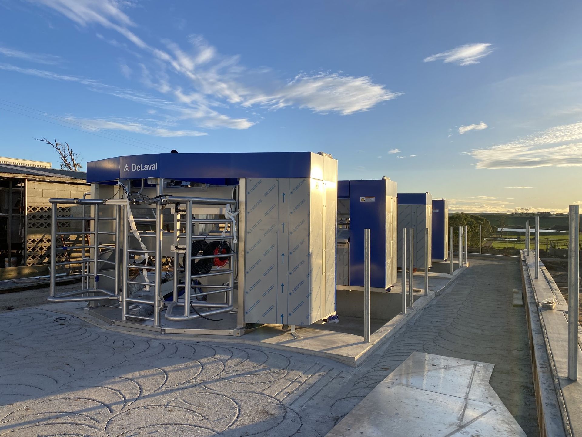 A row of blue and white buildings with a blue sky in the background.