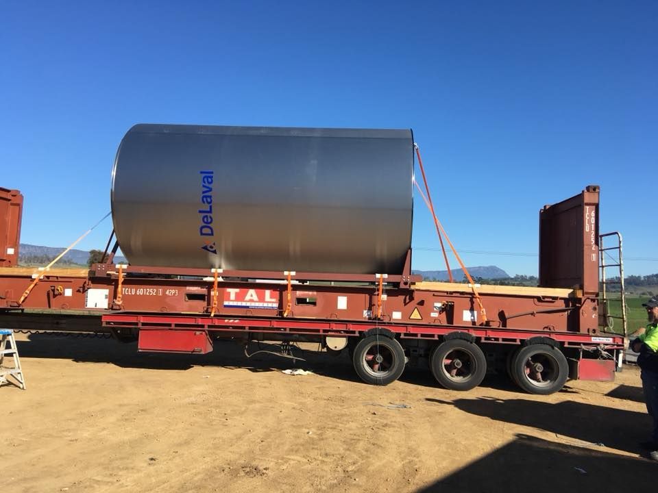 A large cylinder on a trailer that says DeLaval
