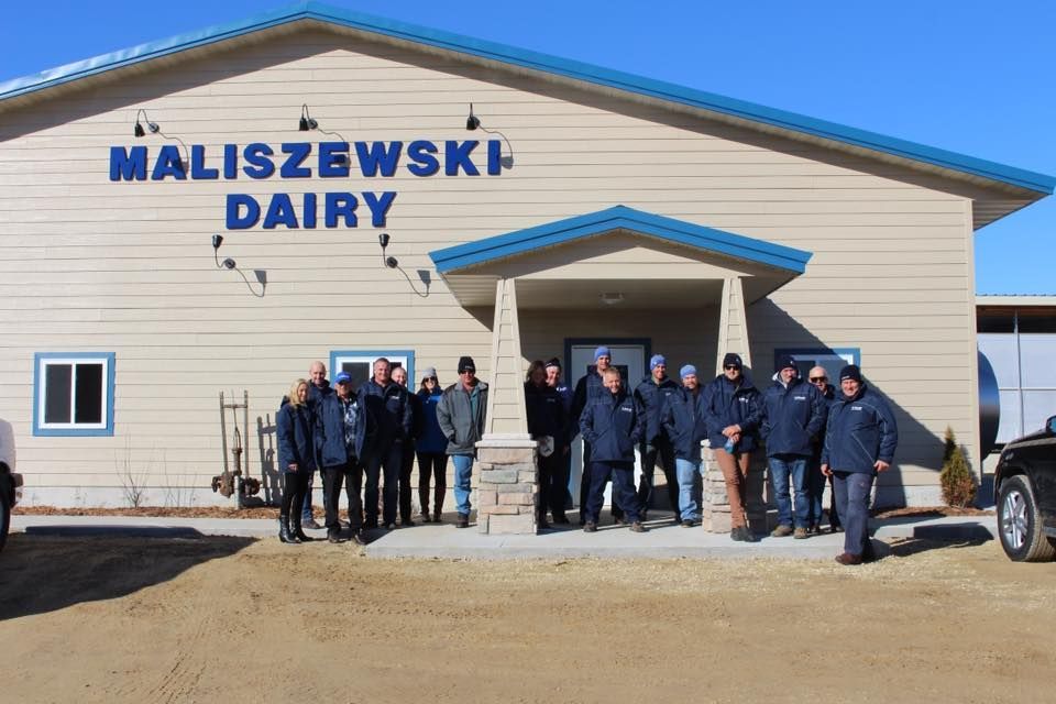 A group of people standing in front of Maliszewski Dairy