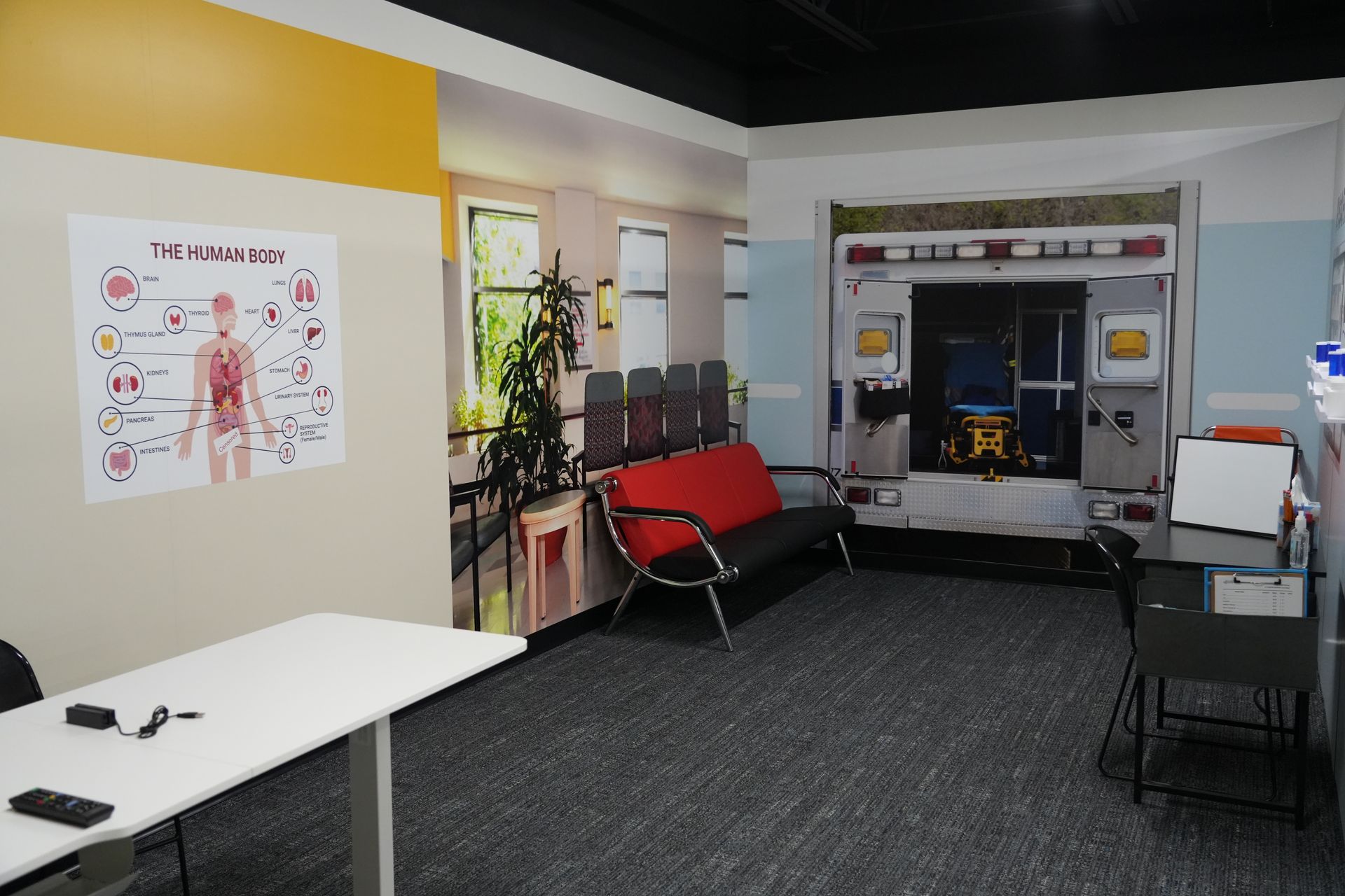 A waiting room with an ambulance in the background