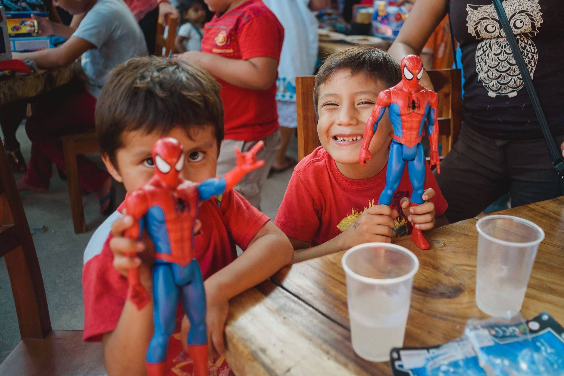 Kids receiving toys from WILD Tulum during Chrsitmas