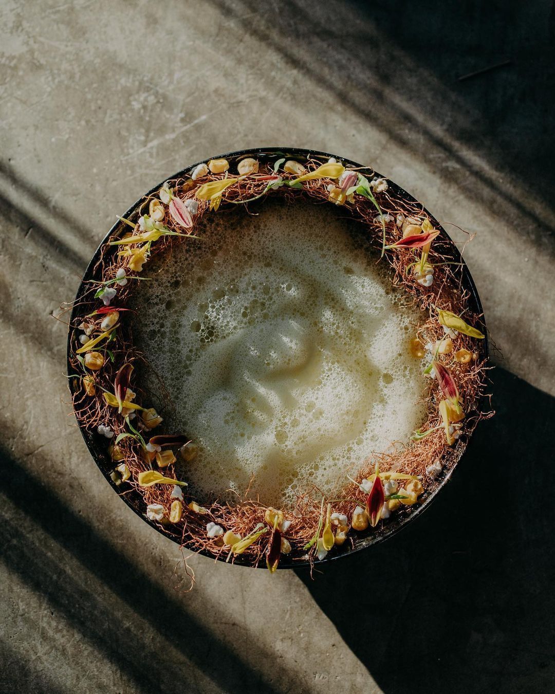 A close up of a bowl of food on a table.