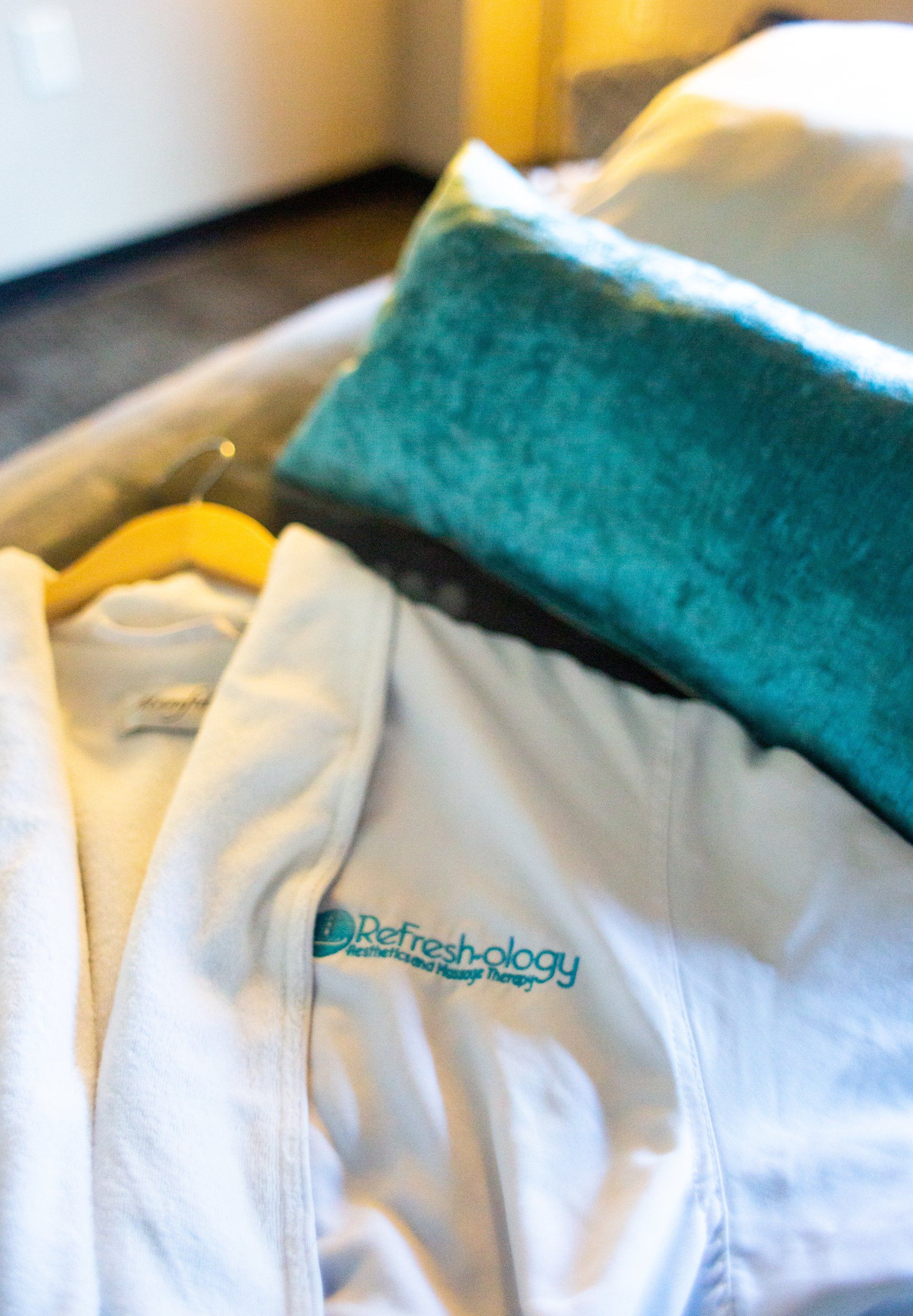 A white robe with the word autochology embroidered on it