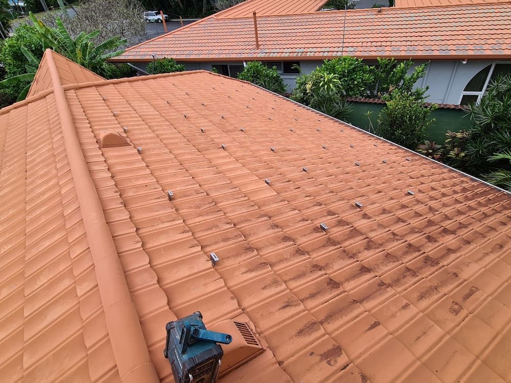 Terracotta Tile Roof with A Rounded Pipe — High Performance Roof Tiling P/L in Kewarra Beach, QLD