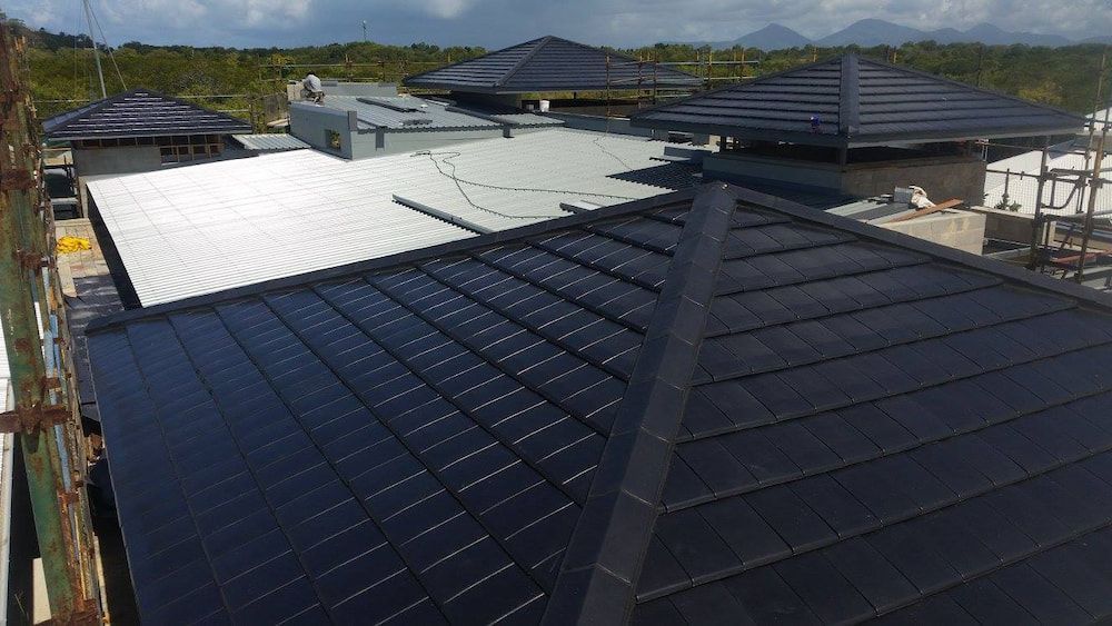 An Aerial View of a House With Solar Panels on the Roof — High Performance Roof Tiling P/L in Mareeba, QLD