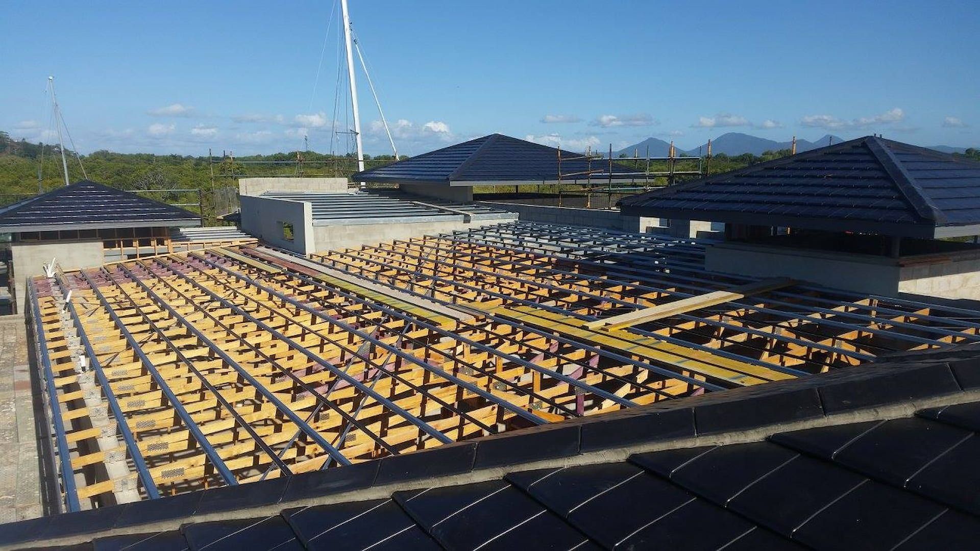 Construction Site: Wooden Framework for A Roof — High Performance Roof Tiling P/L in Kewarra Beach, QLD