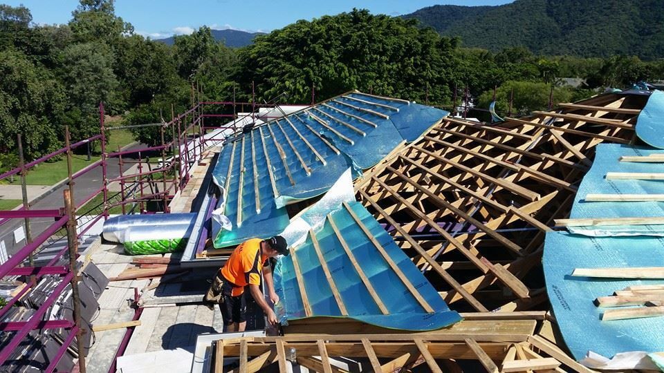 Construction Worker Installing a Curved — High Performance Roof Tiling P/L in Kewarra Beach, QLD