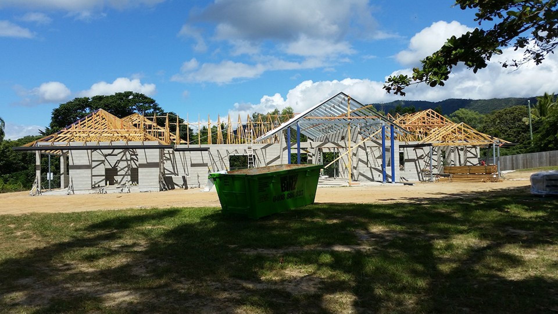 Construction Site: A House Under Construction with Exposed Wooden Roof Framing — High Performance Roof Tiling P/L in Kewarra Beach, QLD