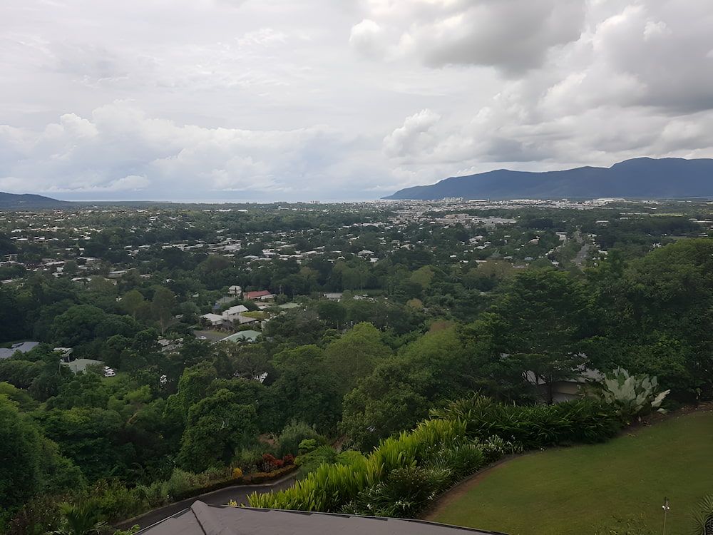 A View of a City With Mountains in the Background — High Performance Roof Tiling P/L in Kewarra Beach, QLD