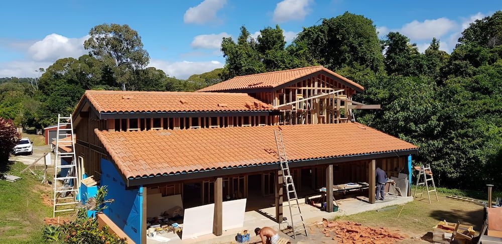 An Aerial View of a House Under Construction With a Tiled Roof  — High Performance Roof Tiling P/L in Atherton Tablelands, QLD