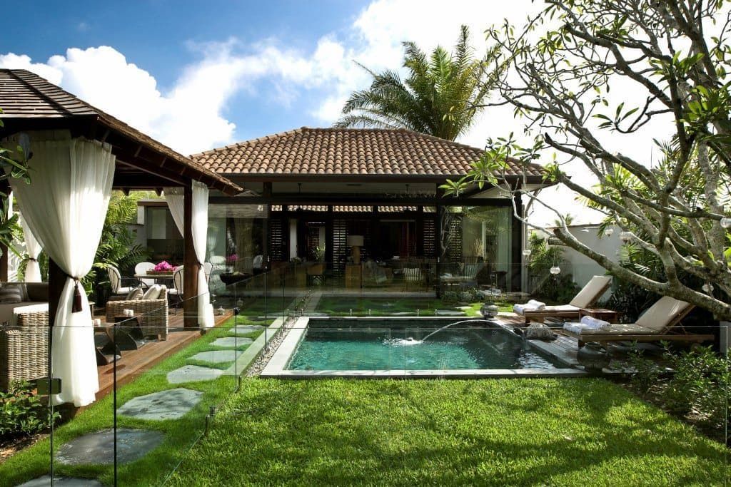 Backyard with A Small Pool, Lounge Chairs, Gazebo, and A House — High Performance Roof Tiling P/L in Kewarra Beach, QLD