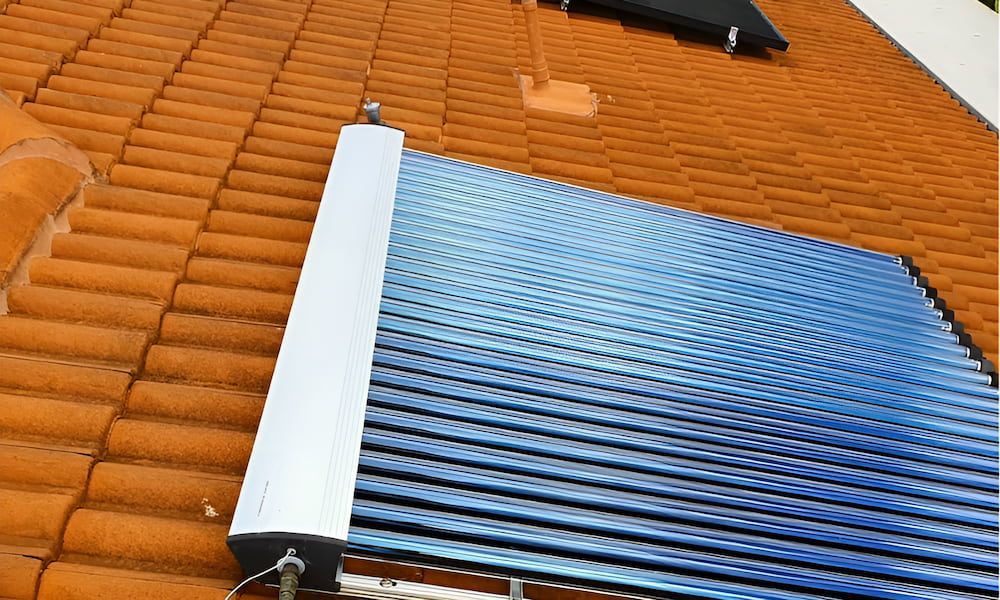 Solar Panel is Sitting on Top of a Tiled Roof — High Performance Roof Tiling P/L in Kewarra Beach, QLD