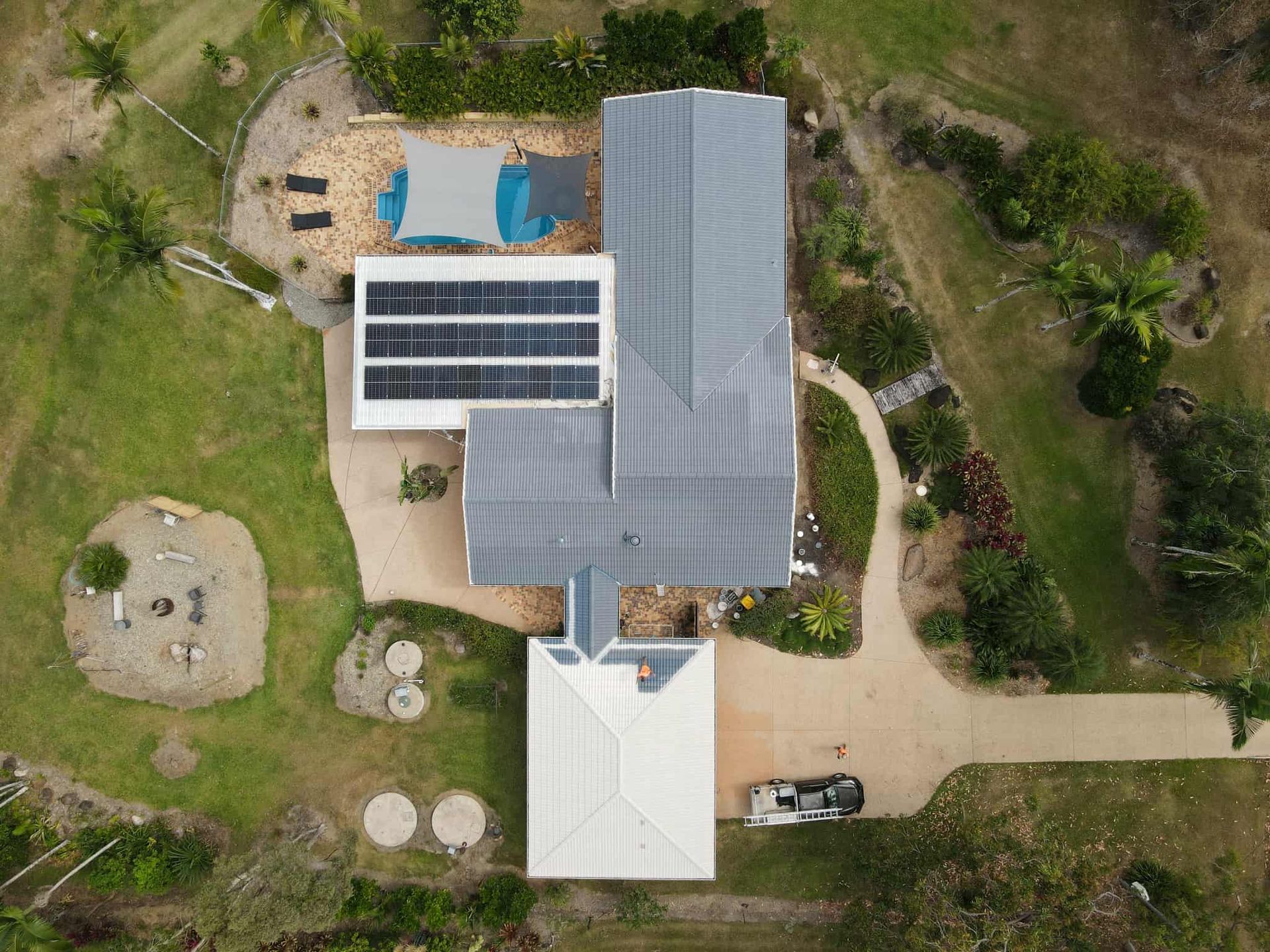 Aerial View of A House with Solar Panels, Driveway — High Performance Roof Tiling P/L in Kewarra Beach, QLD